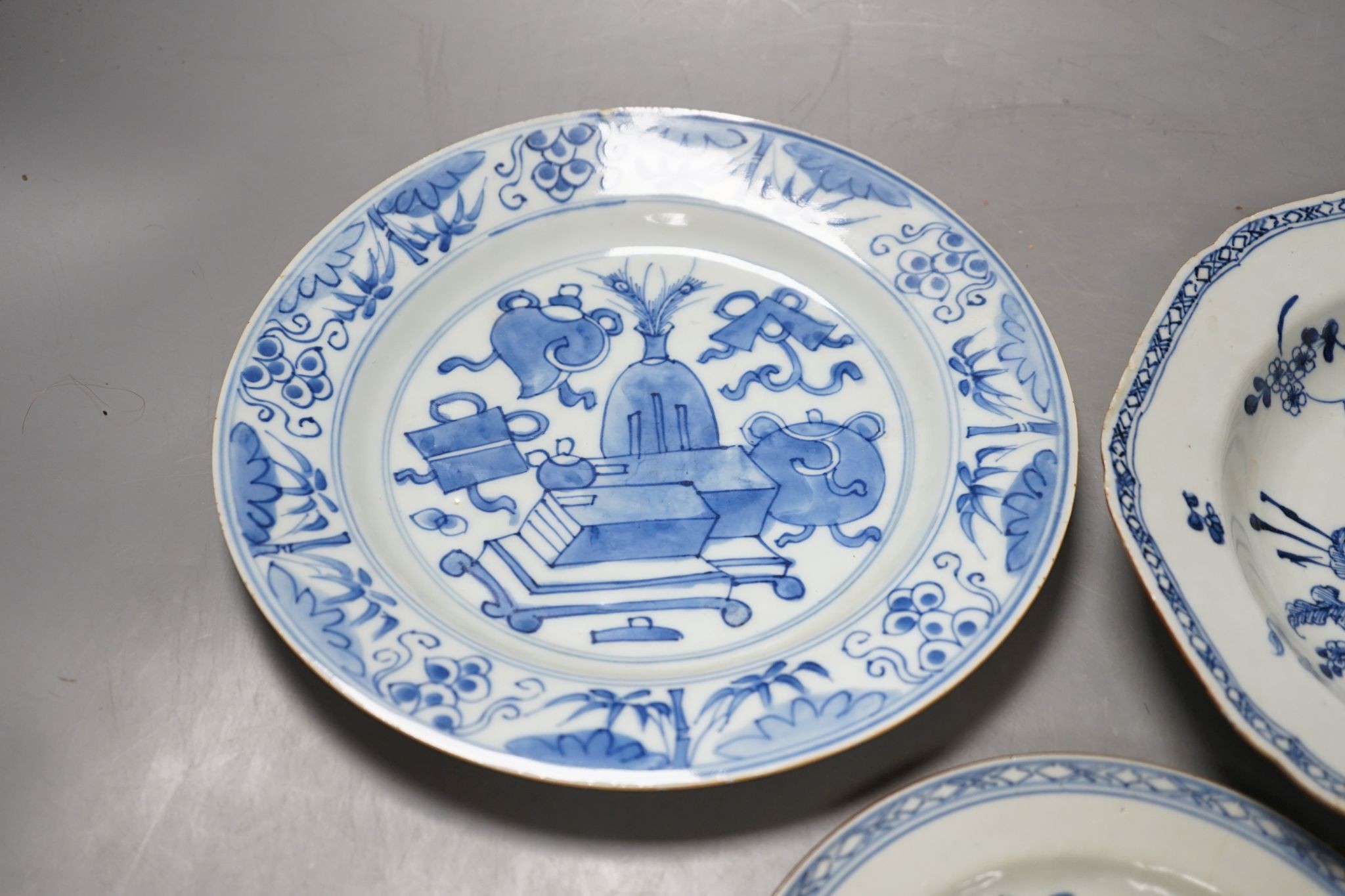 A Set of six 18th century Chinese export blue and white ‘bird in a cage’ small plates, 6.3 cm diameter and two pairs of 18th century Chinese export blue and white plates dishes, largest 23cm diam (10)